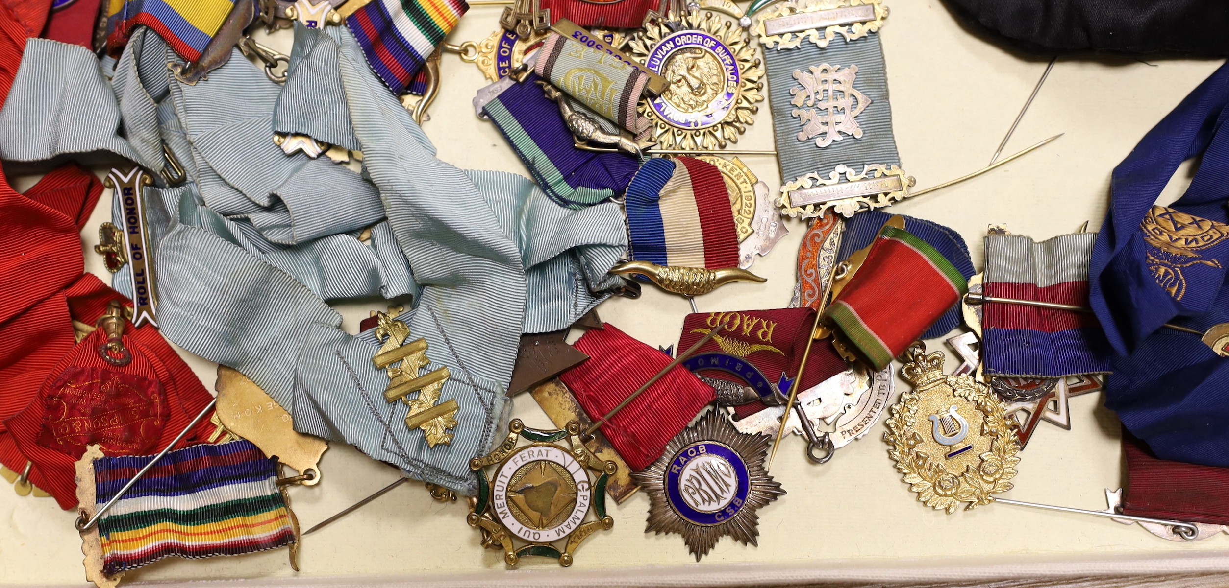 A collection of Kent, local Masonic lodge medals/accessories;, twenty two silver jewels, eleven other medals/jewels and five aprons and associated sashes
